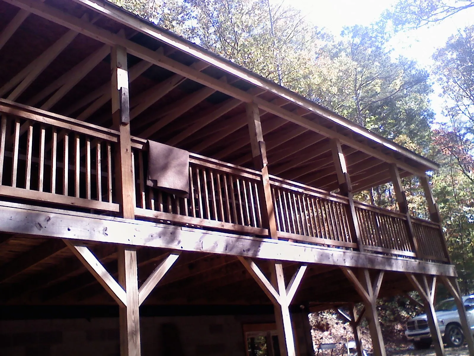 Timber framing under a new elevated porch and deck — Roof Leak Repair in North Sutton by Roofing Brothers